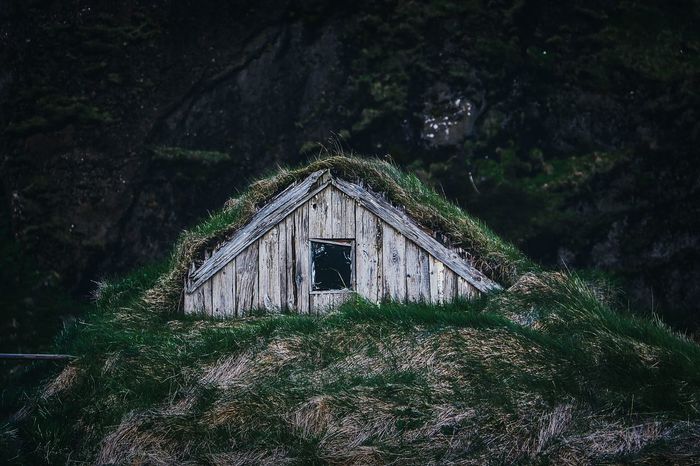 ABANDONED HOUSE ON FIELD