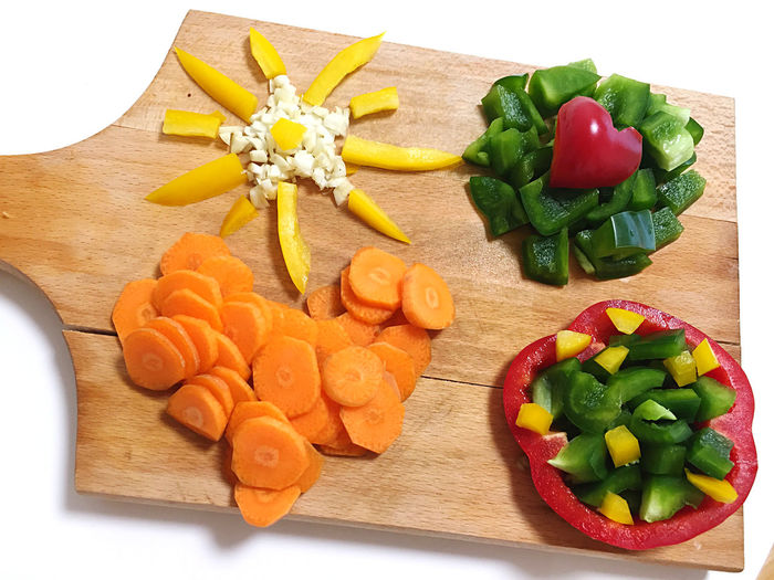 High angle view of chopped vegetables on cutting board