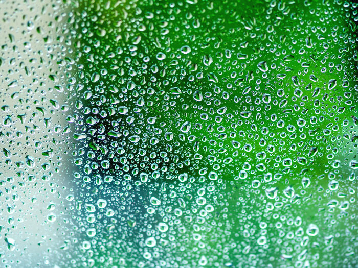 Full frame shot of raindrops on glass