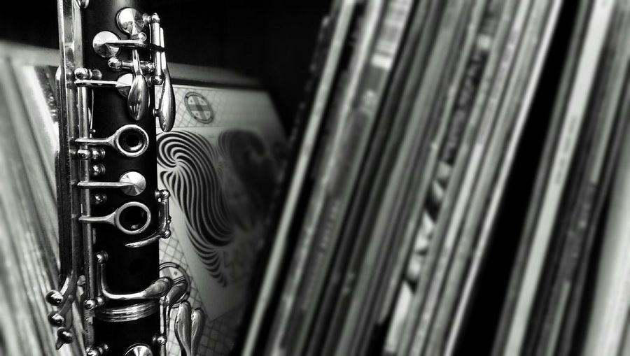 Close-up of clarinet by vinyl records