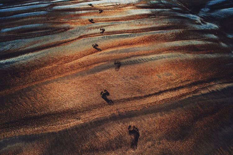 High angle view of shadow on sand