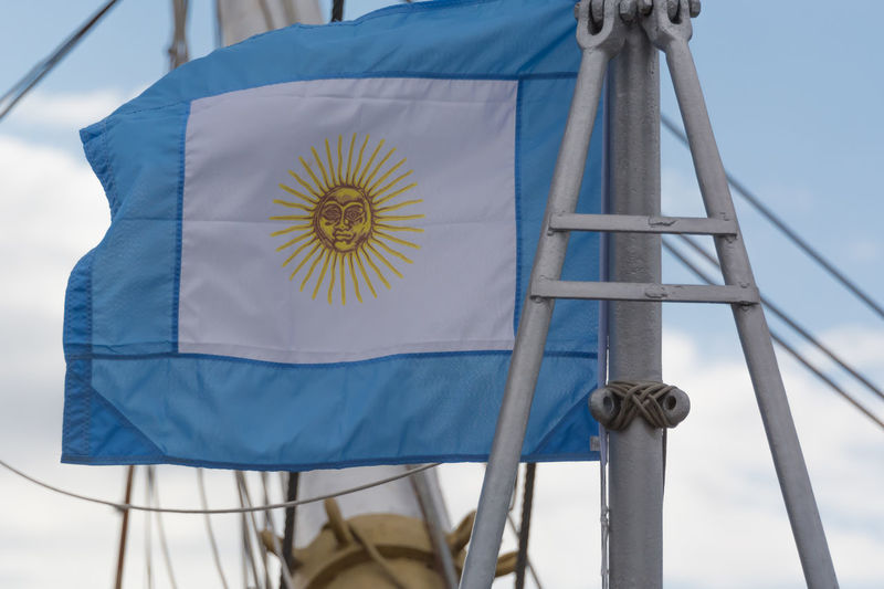 Low angle view of the argentine flag a blue sky