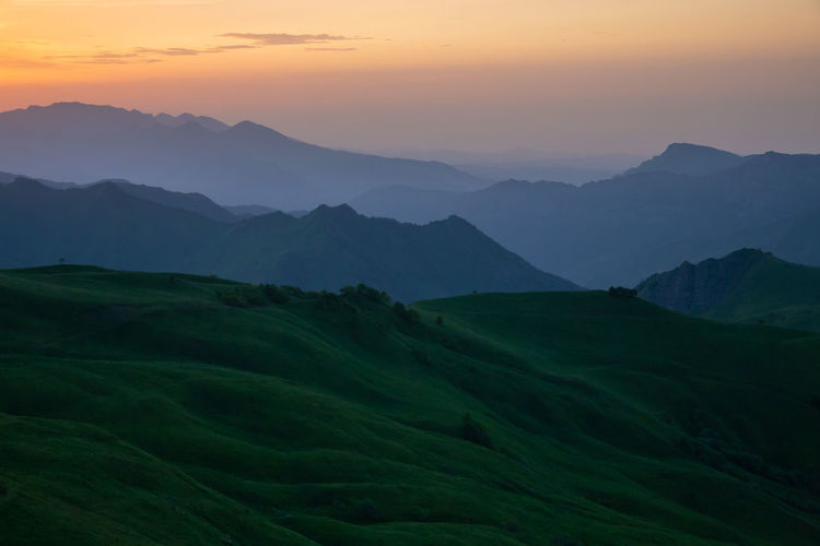 Beautiful sunset in the mountains. scenic view of mountains against sky during sunset