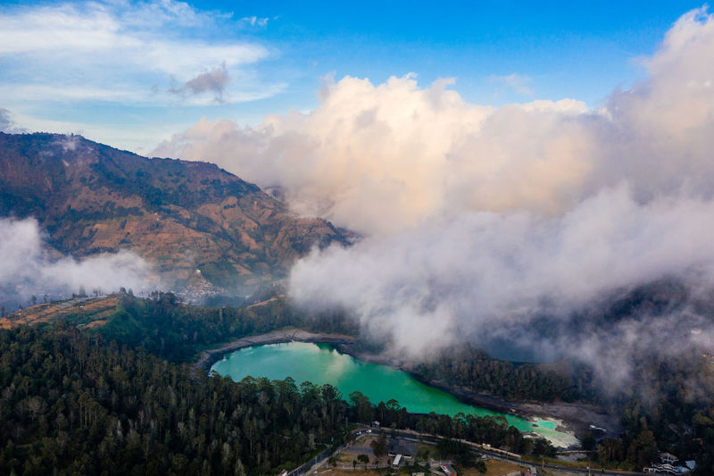 Scenic view of mountains against cloudy sky