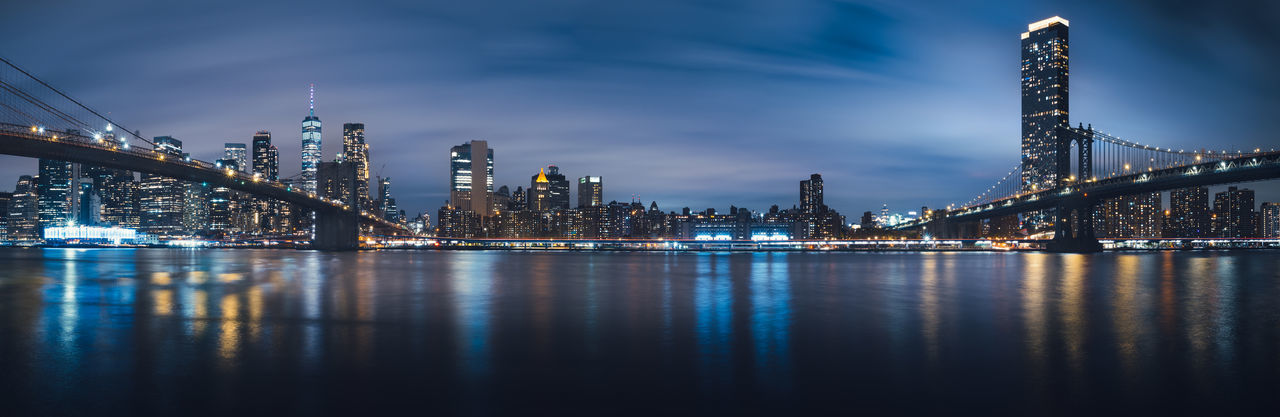 Brooklyn and manhattan bridge night panorama, view towards lower manhattan, new york city