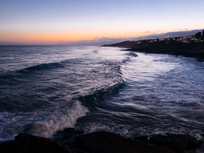 Scenic view of sea against sky during sunset