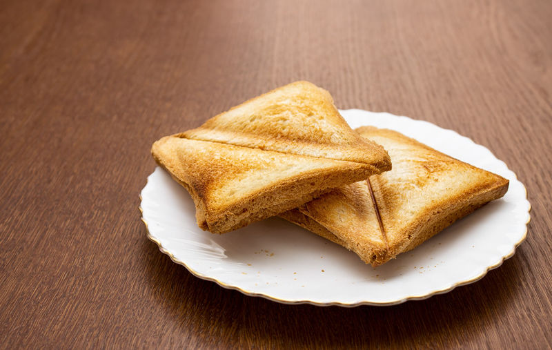 Close-up of bread in plate on table
