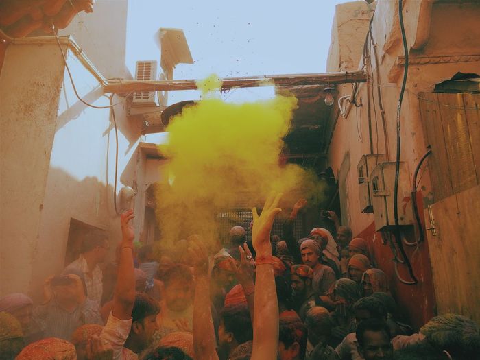People enjoying with colors during holi