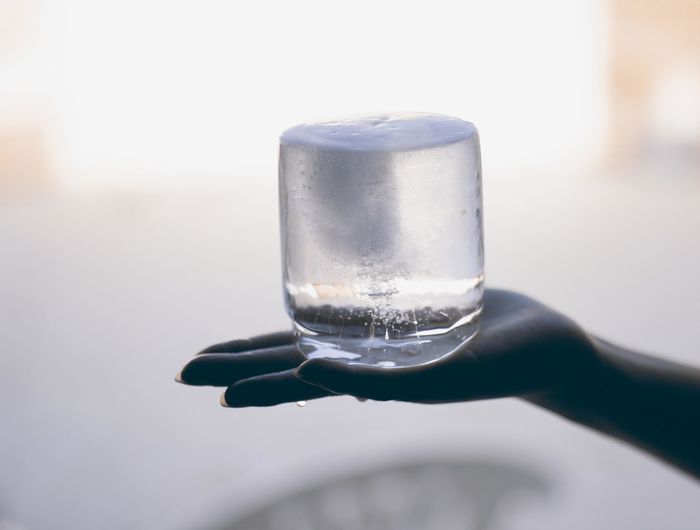Close-up of hand holding ice 