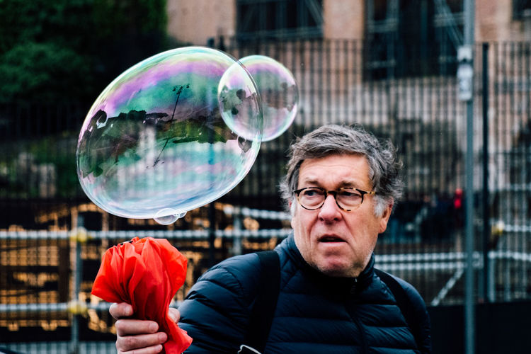 Portrait of man in bubbles