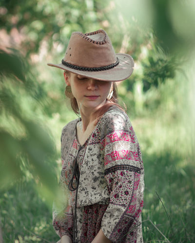 Country style in the garden, woman with hat.
