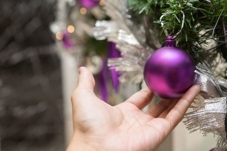 Cropped hand holding bauble