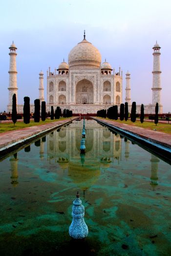 Reflection view of taj mahal against sky