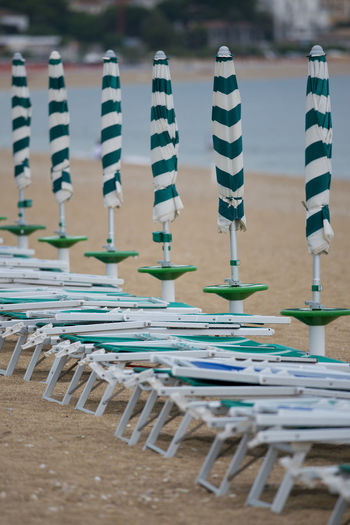 Empty chairs and tables in row