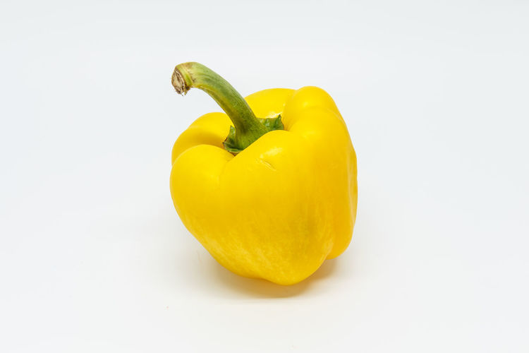 Close-up of yellow bell pepper against white background