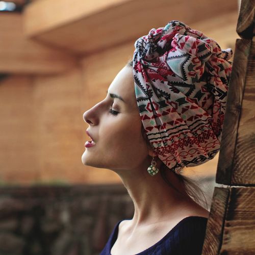 Profile view of beautiful woman wearing headscarf