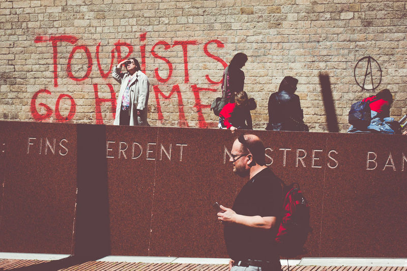 People against graffiti wall