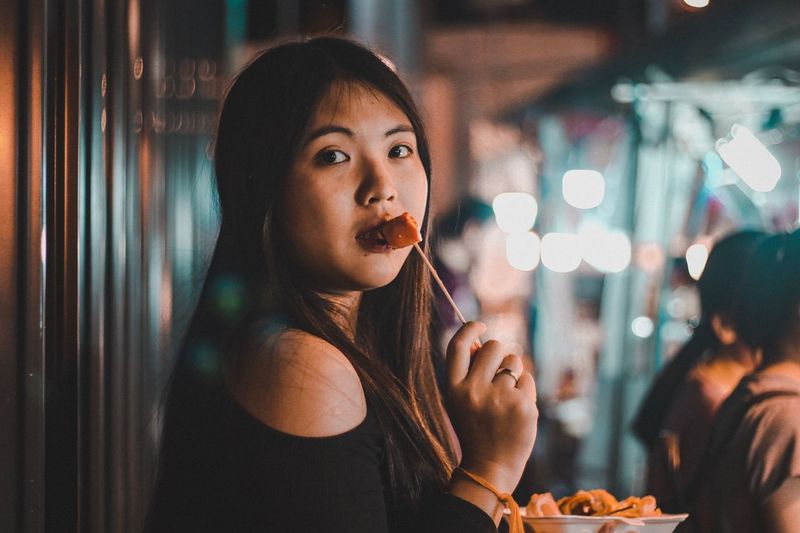 Portrait of woman eating food
