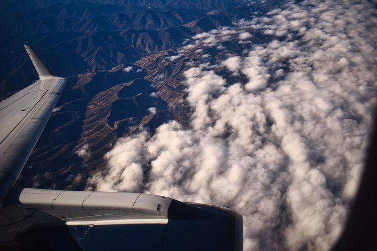View of the hills from the window of an airplane