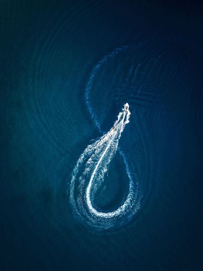 Aerial view of boat swimming in sea