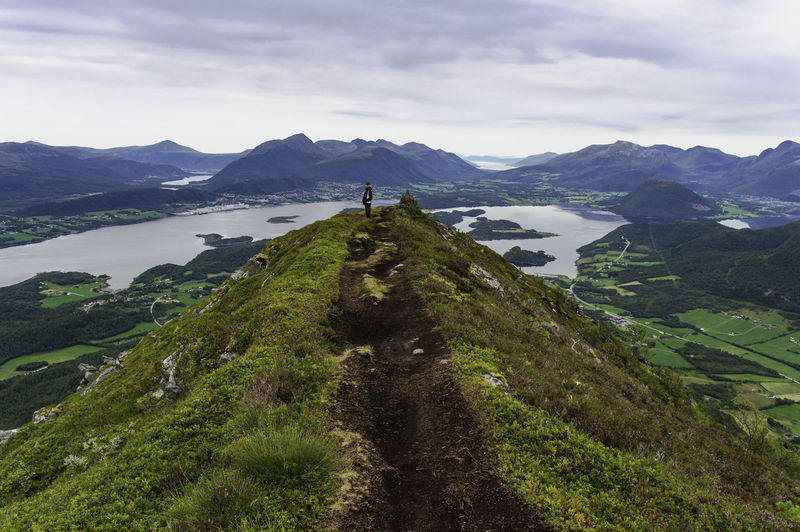 Standing on top of the world. panorama over the mountains of molde in norway