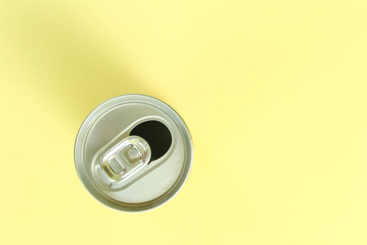 Directly above shot of drink against yellow background