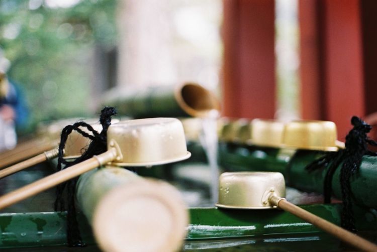 Ladles on japanese drinking fountain in temple