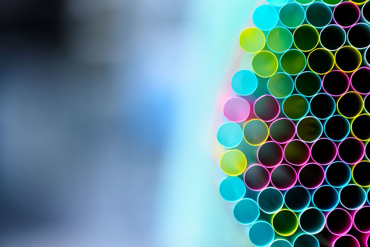 Close-up of colorful straws for sale in store