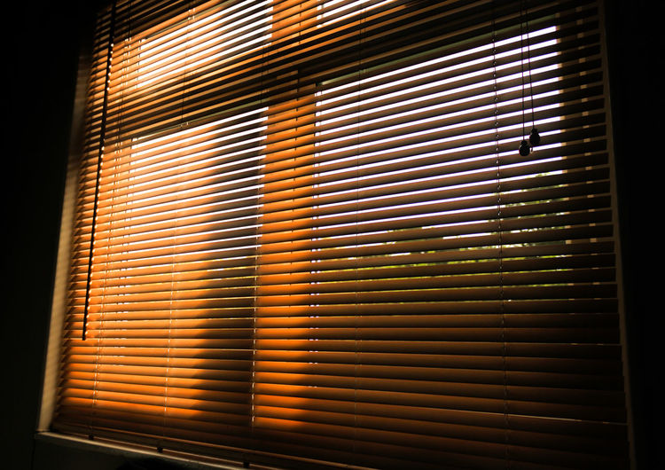 Low angle view of window blinds at home
