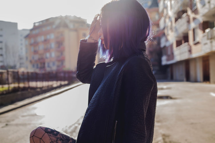 Architecture Casual Clothing Day Focus On Foreground Leisure Activity Lifestyles One Person One Young Woman Only Outdoors People Real People Side View Standing Wireless Technology Young Adult Young Women