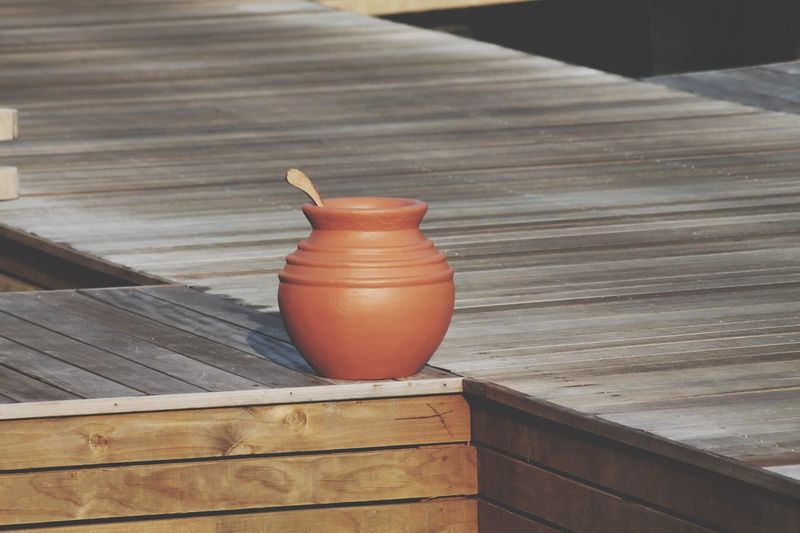 Waterpot on a wood bridge