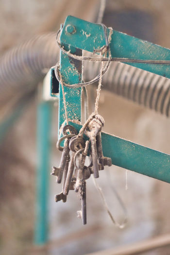 Close-up of rope tied up of metal chain