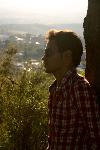 Side view of young man looking away
