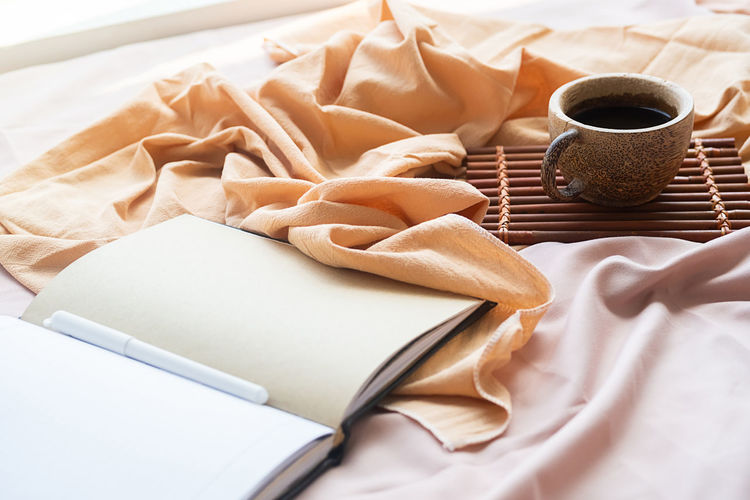 High angle view of coffee on bed