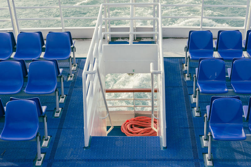 High angle view of empty chairs in a ferry boat