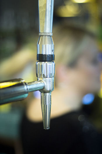 Close-up of beer tap in bar