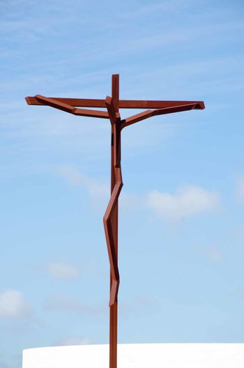 View of wooden crucifix against sky