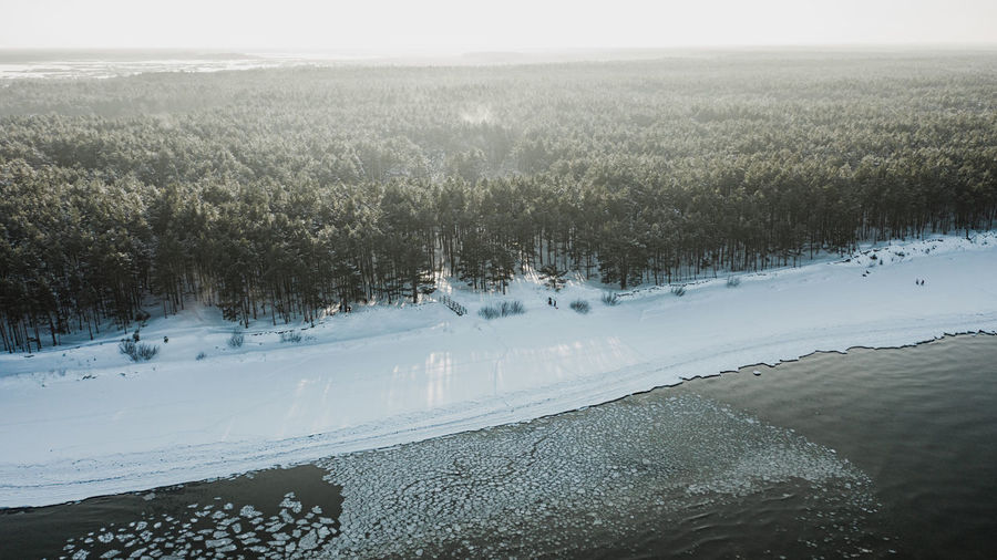 Scenic view of snow covered landscape against sky