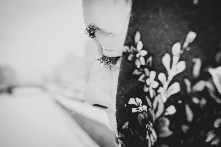 Close-up portrait of young woman with eyes closed
