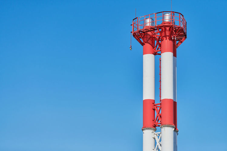Low angle view of tower against clear blue sky