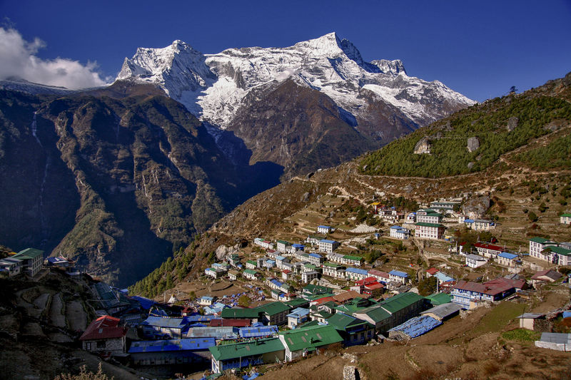 Panoramic shot of buildings against mountain range
