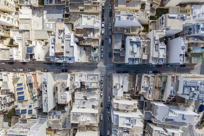 Malta, northern region, saint pauls bay, aerial view of houses surrounding city crossroad