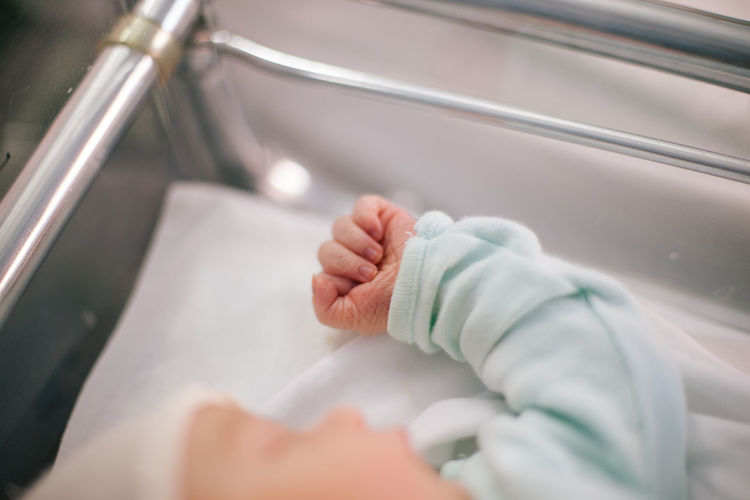 Baby girl in crib at hospital