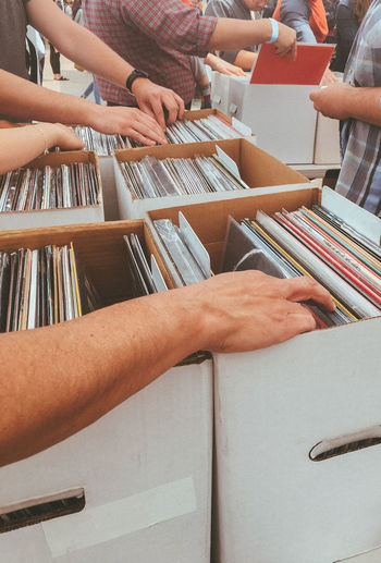 People searching for record in box