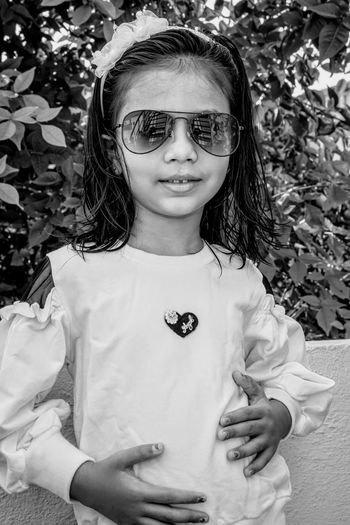 Portrait of cute girl standing outdoors