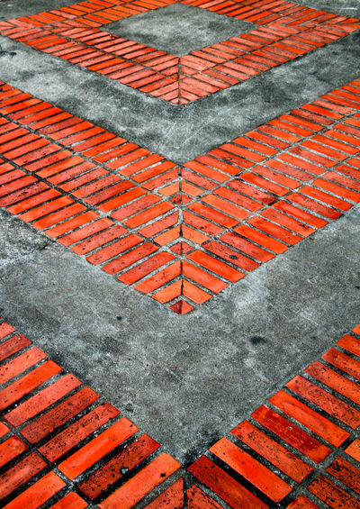 Full frame shot of red brick abstract pattern in the street