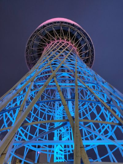 Low angle view of illuminated structure against sky