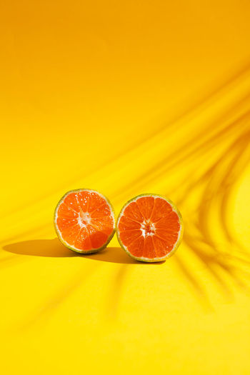 Close-up of oranges against orange background