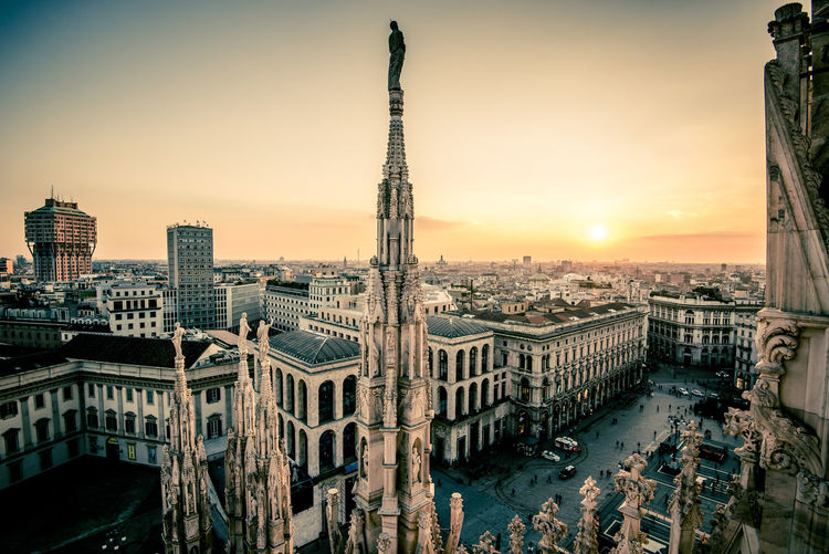 Cityscape against sky during sunset