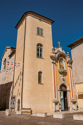 View of church facade under sunny blue sky in vence, in the french provence.
